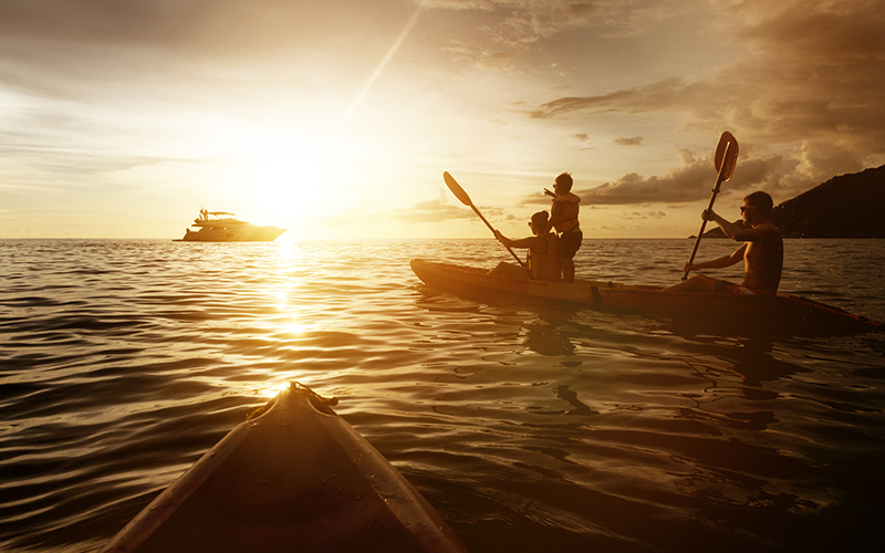 Kayaking in the sunset on open seas